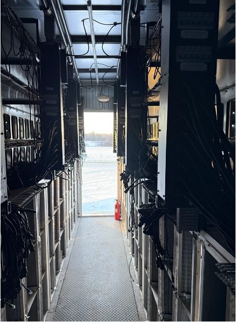Containerized site — interior corridor with racks and cable trays